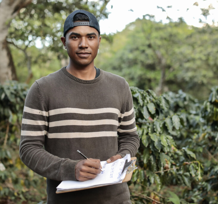 Portrait of Bayron Alejandro Cazún Castro, 26, incharge of Communications and business relations of Raindrop a youth business in charge of agriculture landscape restorations and moisture measurements seen at San Reymundo Coffee Estate, in Ahuachapán, El Salvador that belongs to a cooperative that works with RAICES AHUACHAPAN project.