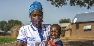 Rahi Awudu (29) and her son at Bugyapala community, Northern Ghana on June 16, 2020. Rahi is a member of CRS initiative IMBC program that aims to support pregnant women and mothers with children under two years of age to become more resilient, decrease the risk for future depression, and manage daily stress effectively. "Before the IMBC program if I don't have money to send my child to the hospital I will get very worried. Now I can attend the meetings and seek help from this program. When my child is healthy I am healthy".