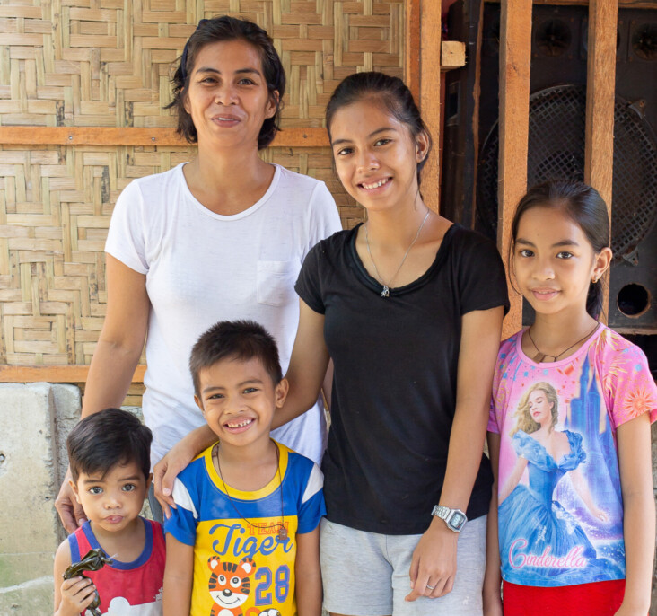 Girli is relieved her new home will offer security to her family—including children Claire Ann, Jielie Mae, Joshua, and Johnson. “I can now focus on my kids. I know I’ll be able to keep them safe,” says Girli. Photo by Jennifer Hardy/CRS.