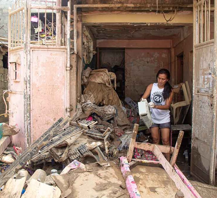 Woman in rubble.